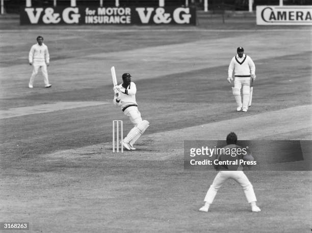West Indian cricketer Clive Lloyd hits D Brown for a six to make 50 during the first innings in the second England vs Rest of The World Test match at...