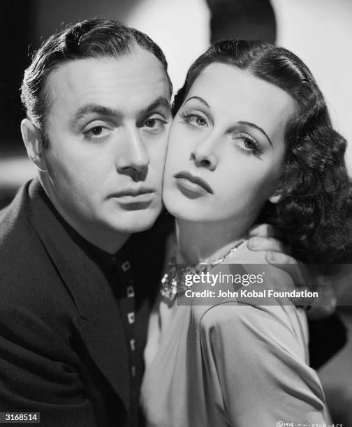 Charles Boyer as Pepe le Moko cheek to cheek with Hedy Lamarr as Gaby in a scene from 'Algiers', directed by John Cromwell.