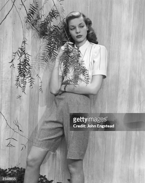 American screen star Lauren Bacall poses for 'Harper's Bazaar' before the start of her lengthy film career. It was these photographs which brought...