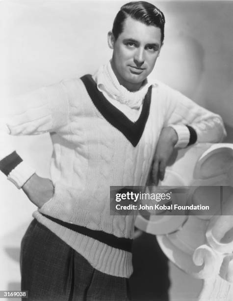 British born actor Cary Grant , born Archibald Leach, wearing a cricket sweater.