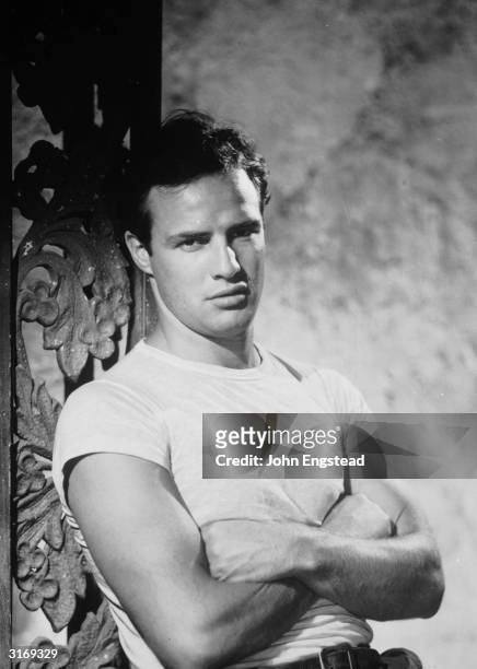 American actor and movie legend Marlon Brando wearing a white T-shirt in an echo of his role in 'The Wild One'.