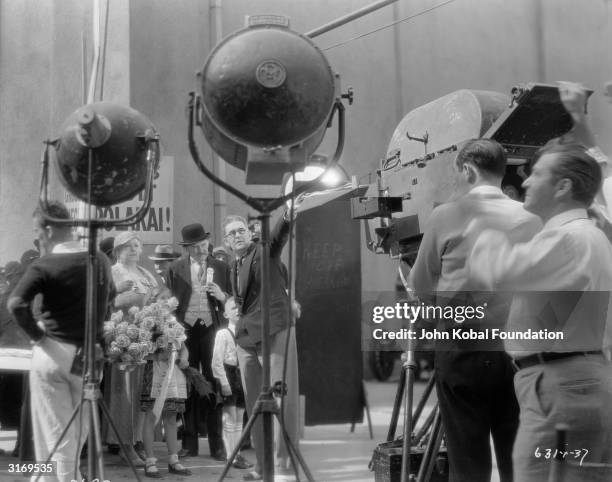 American film director John Ford on the set of 'Flesh'.