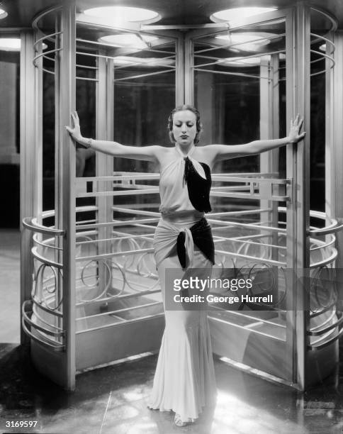 American actress Joan Crawford as she appeared in the title role of Clarence Brown's 'Letty Lynton', wearing an outfit by Adrian.