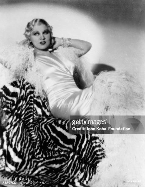 American actress Mae West , the star of such popular films as 'I'm No Angel', 'Klondike Annie' and 'Go West Young Man'. Her brashness and bold use of...
