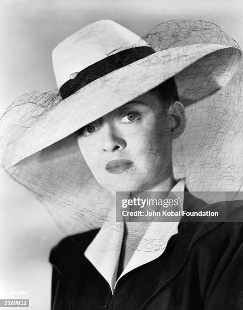 American film star Bette Davis , stars as Charlotte Vale in the romantic melodrama 'Now, Voyager', directed by Irving Rapper.