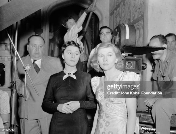 British director Alfred Hitchcock with Judith Anderson and Joan Fontaine , who play Mrs Danvers and the second Mrs de Winter in his latest thriller...