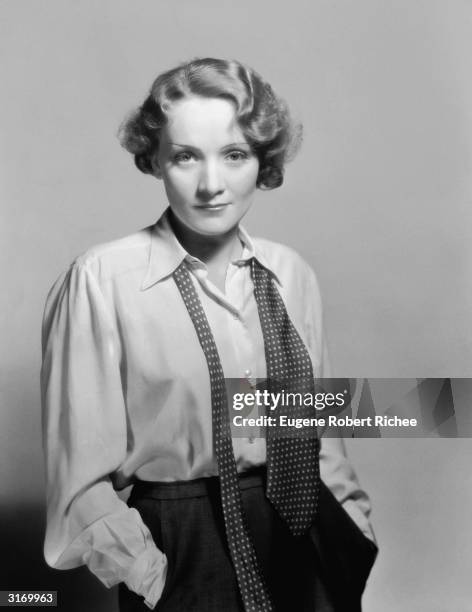 Marlene Dietrich casually dressed in shirt and loosened tie.