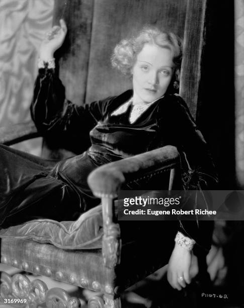 Marlene Dietrich slumped into a velvet chair.