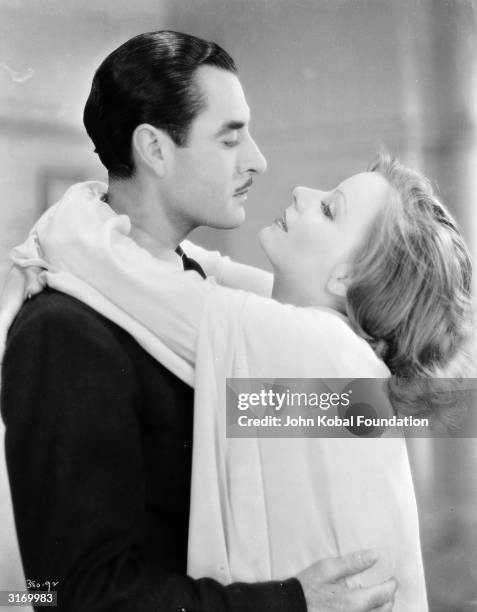 Swedish born American actress Greta Garbo and John Gilbert in the film 'A Woman of Affairs'. The pair starred in several films together and their...