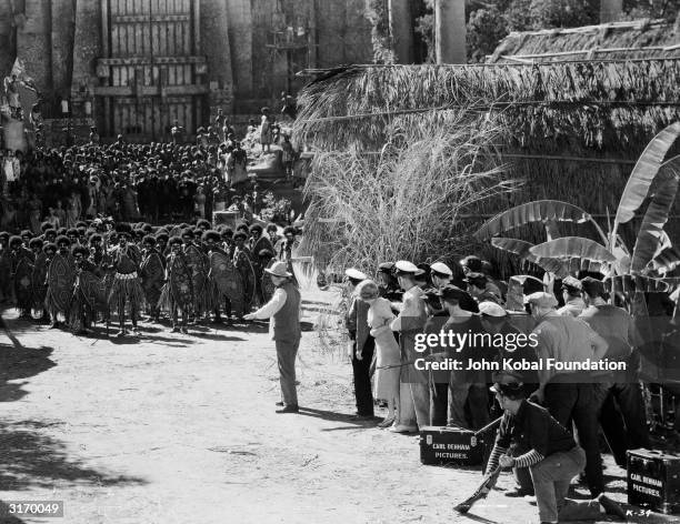 Tentative meeting between the tribespeople and the film crew in a scene from the classic monster movie 'King Kong'.