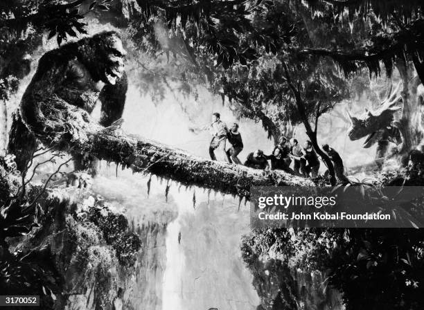 John Cerisoli's model of the giant ape tries to shake the men off their precarious perch in a scene from the classic monster movie 'King Kong'.