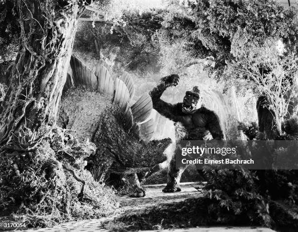 John Cerisoli's models of a giant ape and a dinosaur battle it out in a scene from the classic monster movie 'King Kong'.