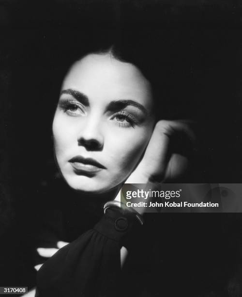 American actress Jennifer Jones with her face surrounded by shadow.