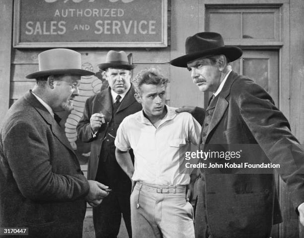 From left to right, Burl Ives , Hal Taggart, James Dean and Raymond Massey star in 'East of Eden', directed by Elia Kazan and based on the novel by...
