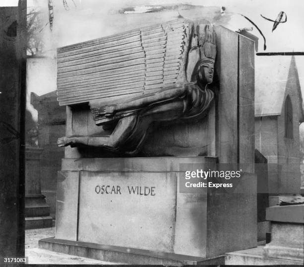 The tomb of the Irish author and playwright Oscar Wilde designed by Sir Jacob Epstein, in Pere Lachaise cemetery in Paris.