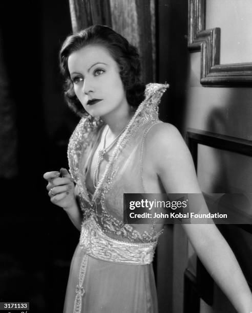 Swedish-American actress Greta Garbo plays Anna Karenina in the romantic drama 'Love', directed by Edmund Goulding.