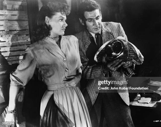 Gene Barry and Ann Robinson are Dr Clayton Forrester and Sylvia Van Buren in the sci-fi film 'War of the Worlds', directed by Byron Haskin and based...