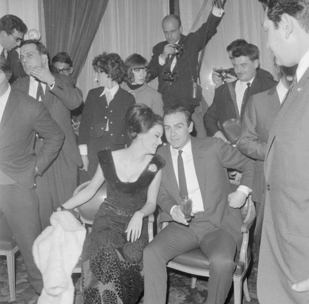 Sean Connery and Claudine Auger, stars of the film 'Thunderball', sharing a joke at a press conference in Paris.