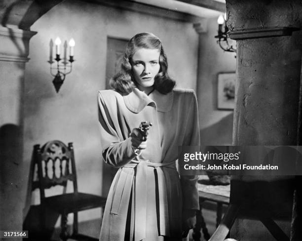 Nancy Guild stars as the disturbed Merle Davis in 'The Brasher Doubloon', a Raymond Chandler detective story directed by John Brahm.