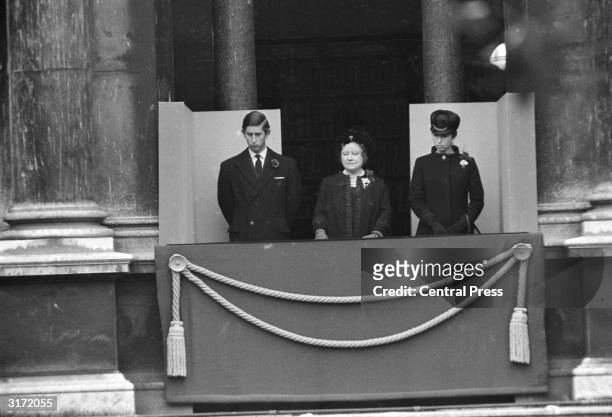 Charles, Prince of Wales, the Queen Mother and Princess Anne look down in a sombre mood at the fiftieth anniversary of the unveiling of the cenotaph...