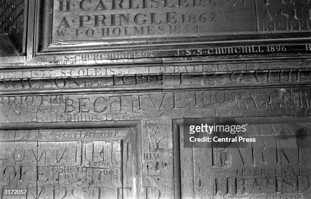 Inscriptions on the wall of the north east corner of the fourth form room at Harrow School, England. In the top left hand corner of the picture the...
