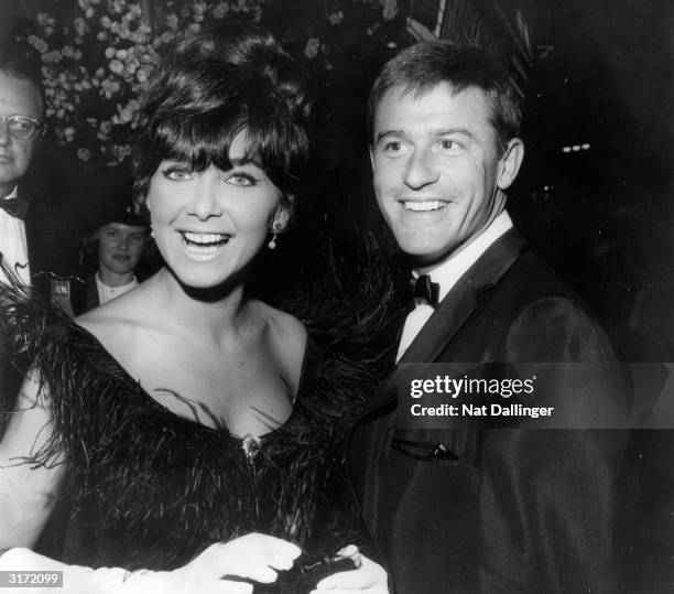 Actress Suzanne Pleshette steps out with Roddy McDowall to the premiere of 'Mary Poppins'. This is Pleshette's first public appearance since her...