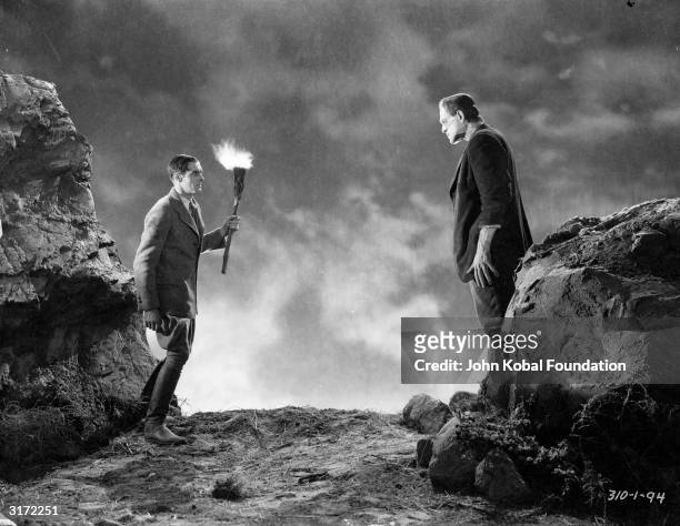 The reanimated monster, played by English actor Boris Karloff , meets his maker, played by Colin Clive in 'Frankenstein', directed by James Whale.