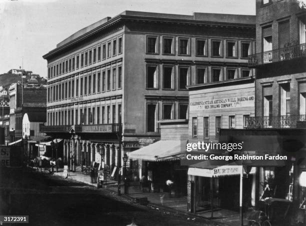 View of Montgomery Street partially cast in shadow, San Francisco, California. The California Steam Artesian Well Boring and Rock Drilling Company...