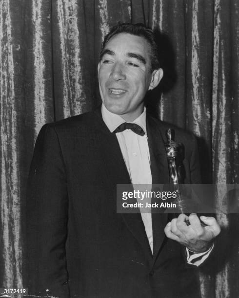 Anthony Quinn holding his Oscar for Best Supporting Actor for his role in director Vincente Minnelli's film, 'Lust for Life,' Los Angeles,...