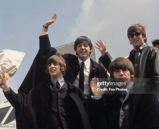 The Beatles arrive back at London Airport after their Australian tour.