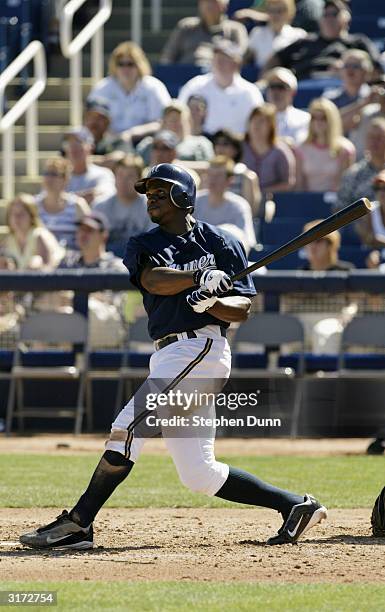 Junior Spivey of the Milwaukee Brewers watches the ball in flight during their spring training game against the Texas Rangers on March 7, 2004 at...