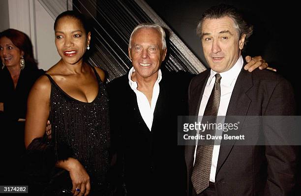 Italian designer Giorgio Armani, American actor Robert De Niro and his wife attend the cocktail party to celebrate "Giorgio Armani Retrospective" at...