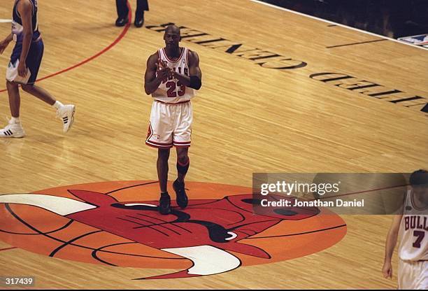 Michael Jordan of the Chicago Bulls walking to the bench duing a time out called during the NBA Finals game 3 against the Utah Jazz at the United...