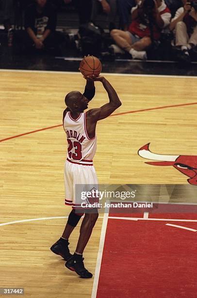 Michael Jordan of the Chicago Bulls shoots a free throw during the NBA Finals game 3 against the Utah Jazz at the United Center in Chicago, Illinois....