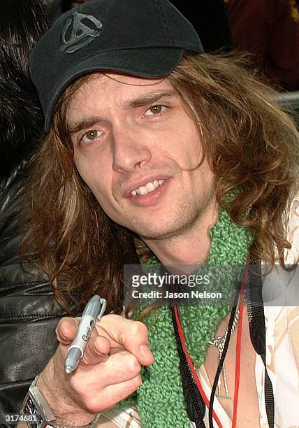 Lead singer of The Darkness, Justin Hawkins, meets with fans to sign their new CD "Permission To Land" at the Rock & Roll Hall of Fame March 30, 2004...