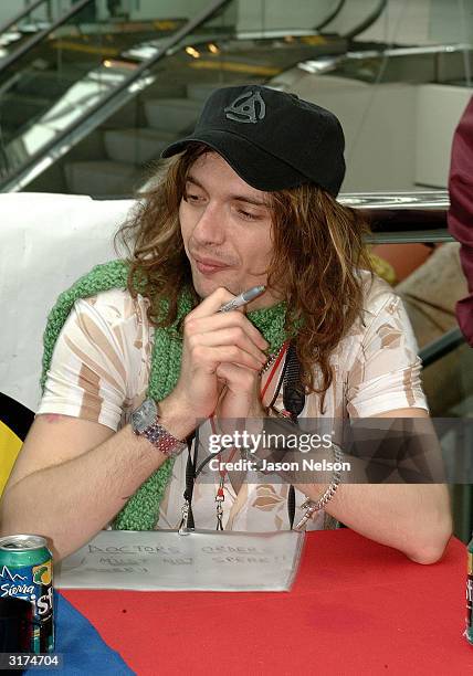 Lead singer of The Darkness, Justin Hawkins, meets with fans to sign their new CD "Permission To Land" at the Rock & Roll Hall of Fame March 30, 2004...