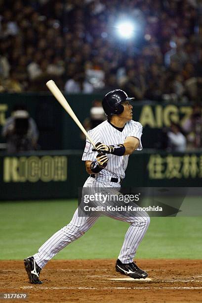 Hideki Matsui of the New York Yankees hits a home run during the second game of the season between the New York Yankees and the Tampa Bay Devil Rays...