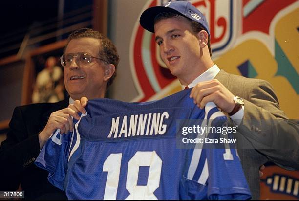 Quarterback Peyton Manning displays an Indianapolis Colts jersey during the NFL draft at Madison Square Garden in New York City, New York. Mandatory...
