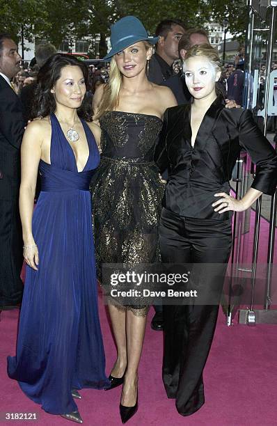 American actresses Lucy Liu, Cameron Diaz and Drew Barrymore arrive at the UK premiere of the film "Charlie's Angels 2: Full Throttle" at the Odeon...