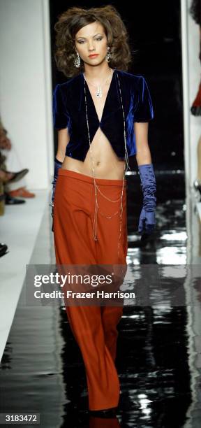 Model wearing Naqada walks the runway at the Mercedes-Benz Fashion Week held at Smashbox Studios, March 31, 2004 in Culver City, California.