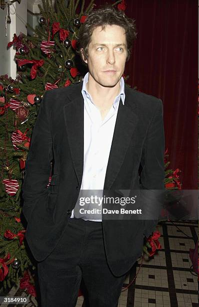 Hugh Grant attends the UK Premiere Party of "Love Actually" at The In and Out Club on November 17, 2003 in London.