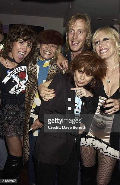 British actor Rhys Ifans and British designer Melanie Smith arrive at the "Wheels and Dolls Baby Party" held at Harvey Nicholls on September 8, 2003...