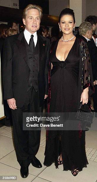 American actor Michael Douglas and British actress Catherine Zeta-Jones arrive at the "Orange British Academy Film Awards 2003" held at the Odeon...