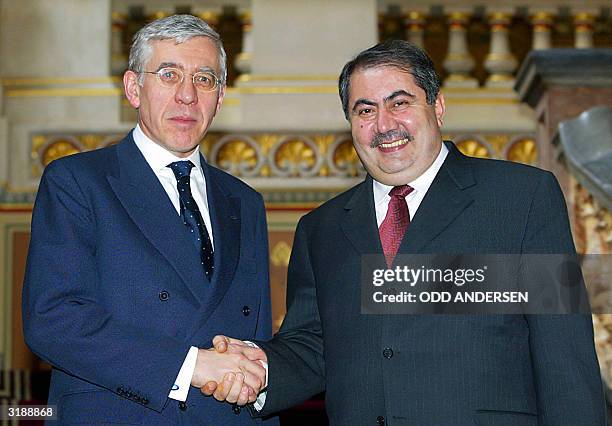 British Foreign Secretary Jack Straw greets Hoshyar Zebari, member of the Iraqi governing council in charge of foreign affairs at the Foreign and...