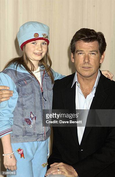 Actors Pierce Brosnan and Sophie Vavasseur attend a photocall for the motion picture release "Evelyn" at Claridges Hotel on March 17, 2003 in London.