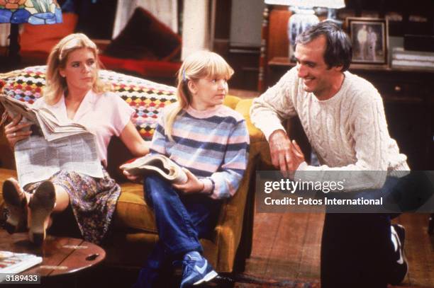 Left to right, American actors Meredith Baxter Birney, Tina Yothers, and Michael Gross appear in a scene from the television sit-com, 'Family Ties,'...