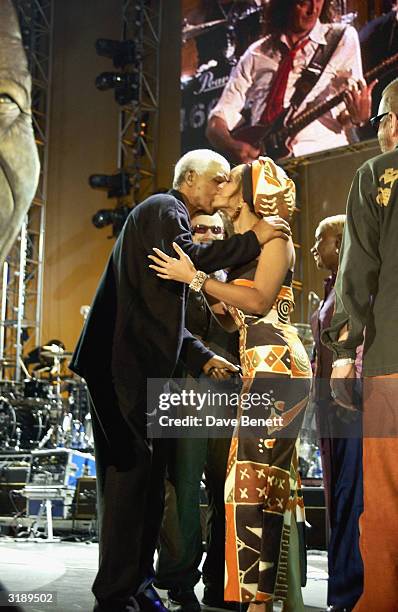 American singer Beyonce Knowles and South African politician Nelson Mandela appear on stage as part of the "Give 1 Minute to AIDS" concert for The...