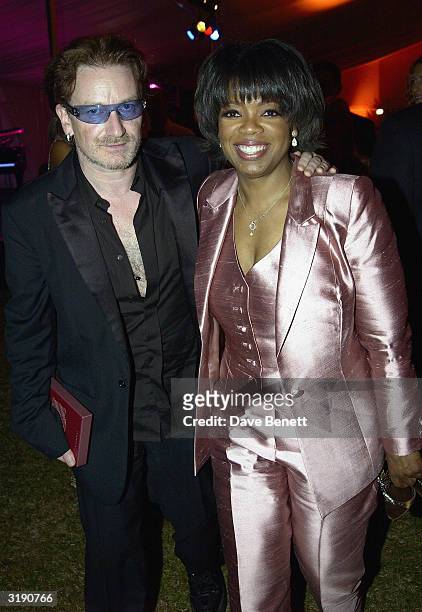 American television presenter Oprah Winfrey and British singer Bono attend a gala dinner held at the Vergelegen Estate outside Cape Town prior to the...