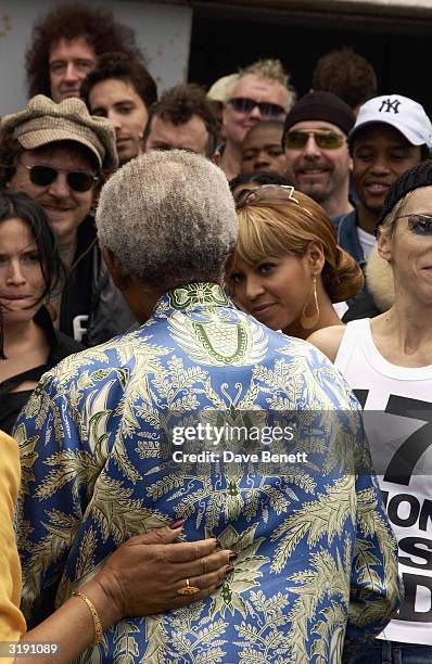 South African politician Nelson Mandela attends a press conference outside his former prison cell on Robben Island where Nelson Mandela was...