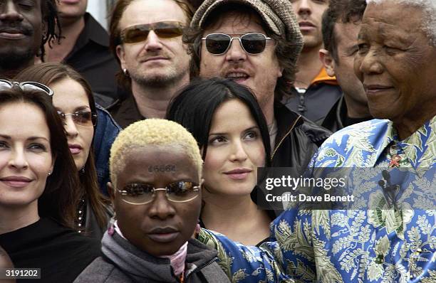 South African politician Nelson Mandela attends a press conference outside his former prison cell on Robben Island where Nelson Mandela was...